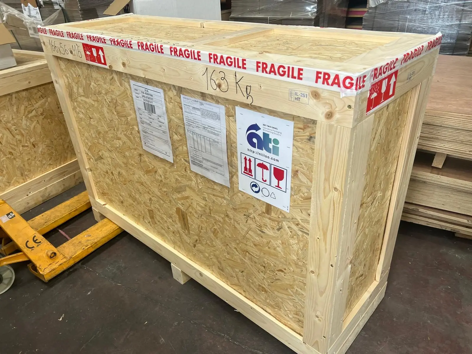 A large wooden shipping crate marked fragile